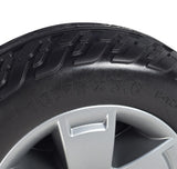 10.75 Flat-Free Rear Wheel Assembly for the Pride Victory 10.2, featuring a black tire with PU foam mounted on a 5-spoke silver rim, shown in a close-up.