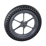 Right Drive Wheel Assembly with Dark Gray Rim for the Jazzy Passport Power Chair, featuring a black, flat-free tire with honeycomb construction and visible holes for enhanced performance.