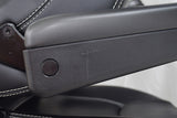 Close-up of the 20 Seat for the Pride Mobility Sport Rider Scooter (Blemished), highlighting the black armrest, keyhole, and leather surface detailing.