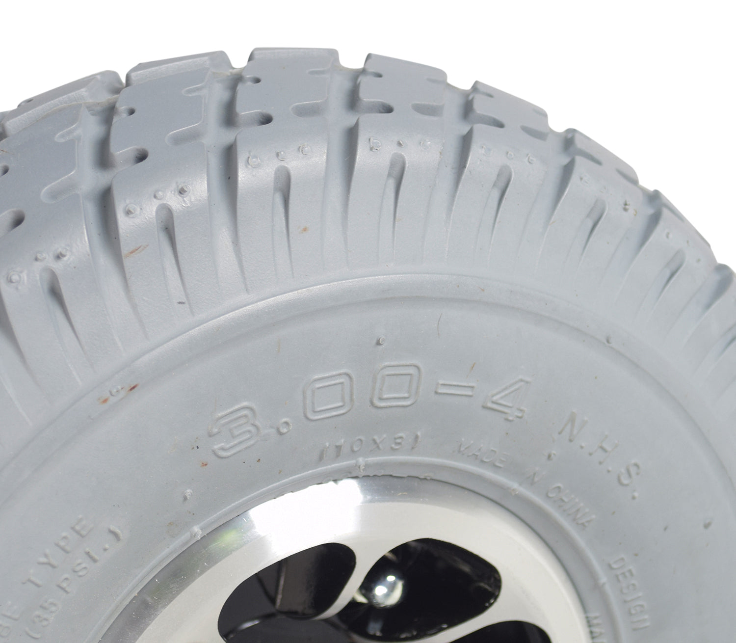 Close-up of the 3.00-4 (10x3, 260x85) Rear Wheel Assembly with Gray Pneumatic Tire for Pride Celebrity X, Cyclone, & Victory 10 mobility scooters, showcasing the tread and black micro mag rim.