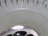 Close-up of the 3.00-4 (10x3, 260x85) Pneumatic Drive Wheel Assembly for Jazzy and Jet Power Chairs, highlighting the tire's tread and split rim design with bolts on the backside of the rim.