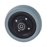 6x2 Flat-Free Caster Wheel Assembly with Gray Tire for Jazzy Power Chairs, featuring a black rim, bearings, and spacer.