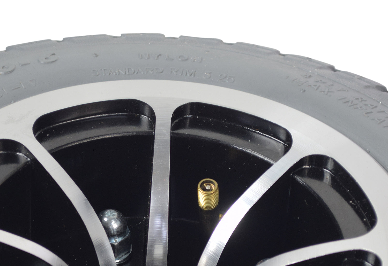 4.10/3.50-6 Pneumatic Drive Wheel Assembly for Jazzy 1143/1143 Ultra, showcasing a close-up of the tire's tread pattern, inner tube, and Micro-Mag hub, highlighting its detailed construction.