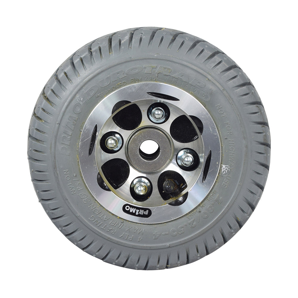 Flat-Free Rear Wheel Assembly for Pacesaver Plus III Scooters, featuring a robust tire with Primo Durotrap tread and a durable metal rim, designed for reliable use in various environments.