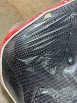 Black & Red Seat for the Baja MB165 & Falcon Mini Bikes (Blemished), displayed with protective plastic wrap on a cushion, highlighting its sleek design and potential compatibility with Baja MB200 models.