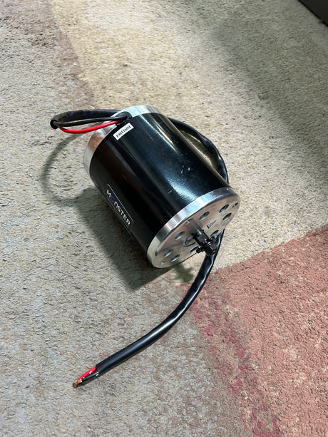 24 Volt 500 Watt MY1020 Electric Motor with 11 Tooth #25 Chain Sprocket (Blemished), featuring black wires and visible mounting holes for secure attachment.