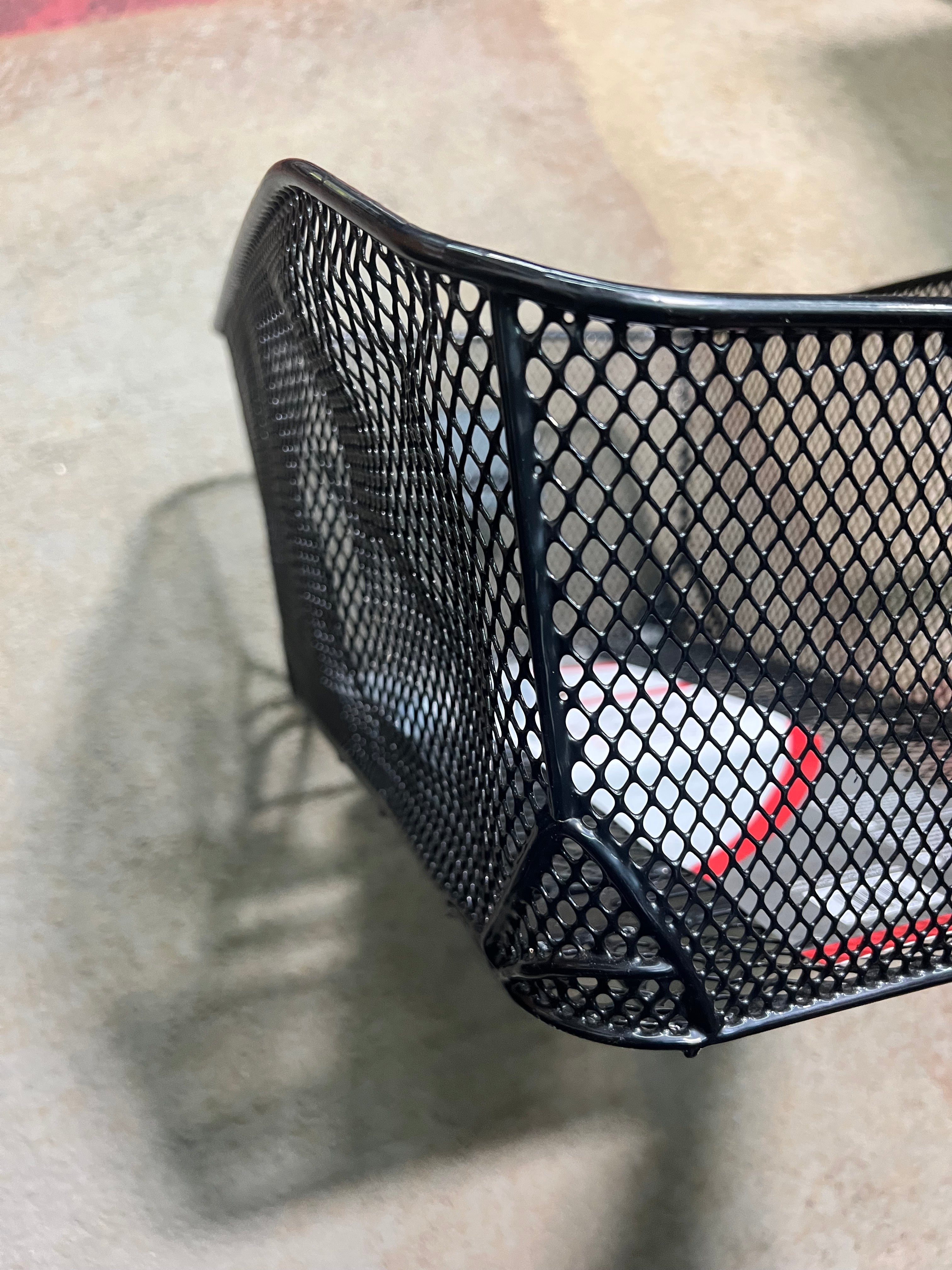 Market-Style Rear Basket for Bicycles (Axiom) (Blemished) – a black mesh basket with a vinyl-dipped steel wire construction, mounted on a bike's rear rack.