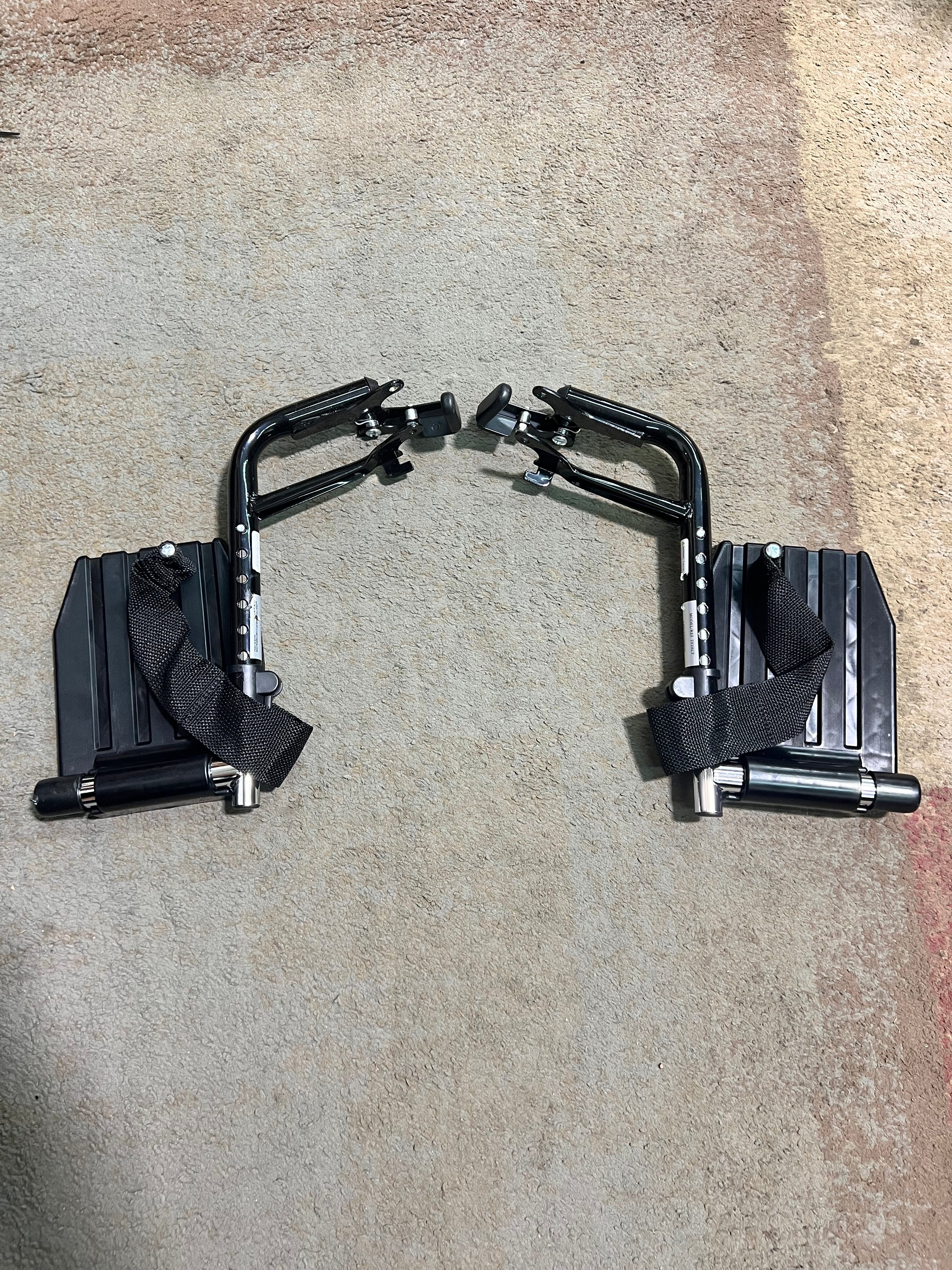 Hemi Footrests with Composite Footplates & Heel Loops for Invacare Insignia, Tracer EX2, and Tracer SX5 Wheelchairs (Set of 2) (Blemished), showing metal foot pedals and black straps.