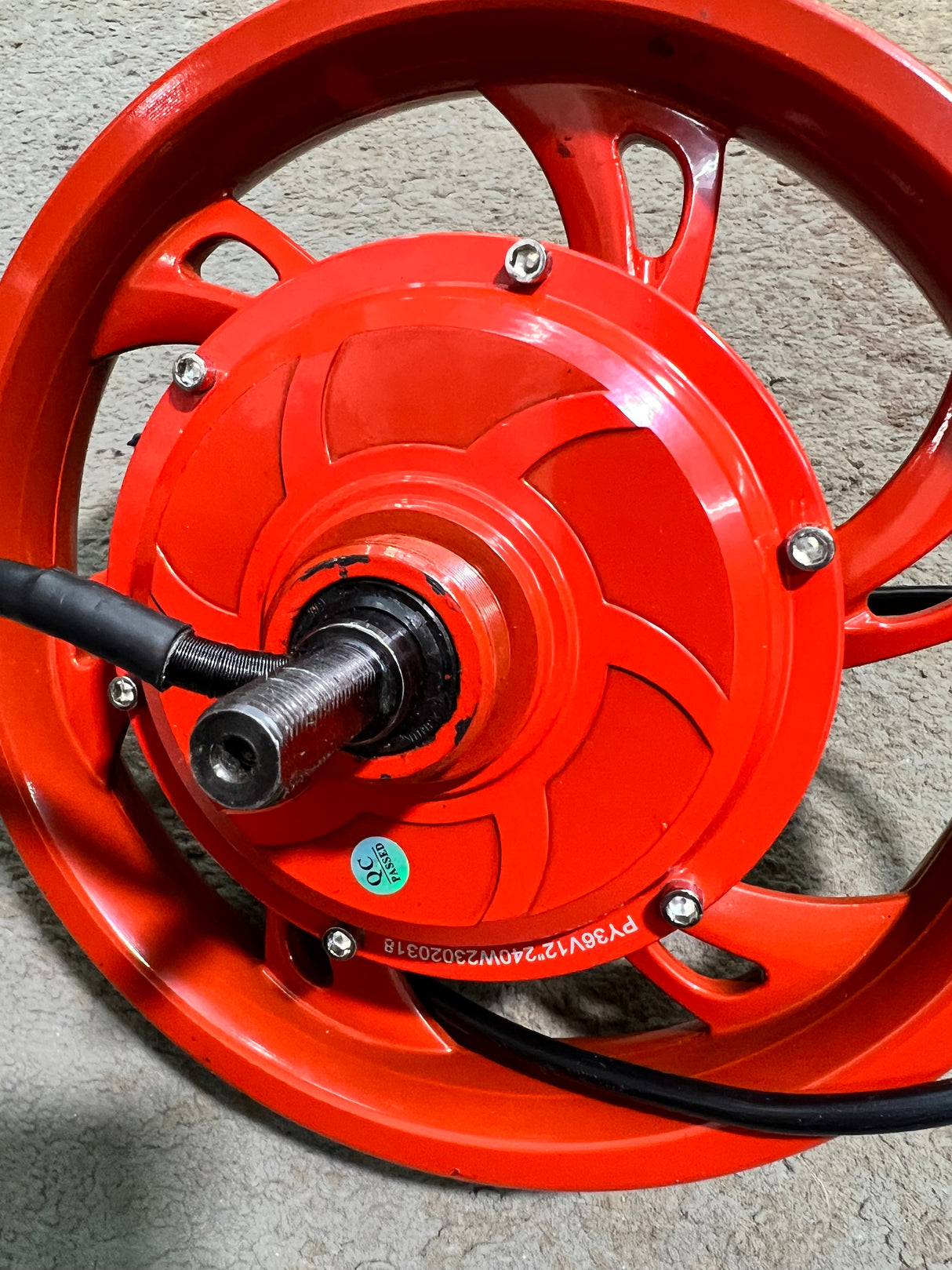 36 Volt Hub Motor & Red Rim for the Jetson Bolt Electric Bike (Blemished) featuring a red wheel with a black cable, integrated axle, crown nuts, and an 8-wire harness.