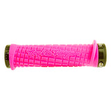 Pink Troy Lee Lock-on Handlebar Grips for Bikes & Scooters with black caps, featuring grooved channels and overmolded flap for added protection, and custom flanged design providing 143 mm of gripping surface.