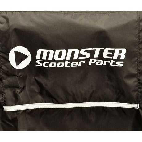 Power Chair Cover Universal Fit, black with white Monster Scooter Parts logo and a reflective safety strip, designed to fit various power chairs, featuring a tightening cord and built-in belt loops for secure attachment.