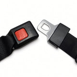 Power chair seat belt buckle unlatched, showing red PRESS release button and chrome metal latch plate