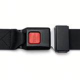Red push-button seat belt buckle latched on black webbing, power chair lap belt