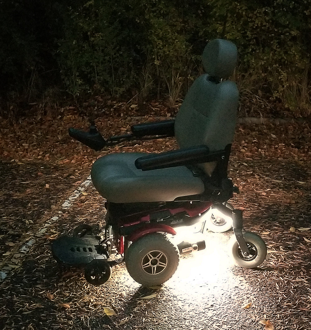 Multi-Color LED Light Kit for Jazzy Power Chairs, shown on a wheelchair with activated lights, highlighting multiple light strips attached to the chair's frame, ready for customization and vibrant illumination.