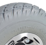 Close-up of the 3.00-4 (10x3, 260x85) Foam-Filled Drive Wheel Assembly for Invacare Pronto Power Chairs, highlighting the tire tread and rim details.