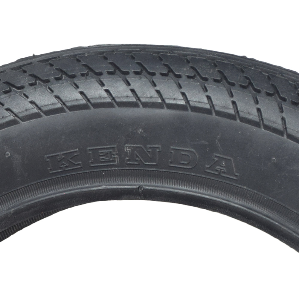 Close-up of the 12-1/2x2-1/4 Scooter Tire with K912 Tread, showcasing the directional v-shaped sipes and detailed tread pattern.