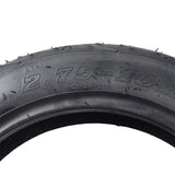 2.75-10 Tubeless Pneumatic Scooter Tire with C917 tread pattern, shown in close-up, highlighting the detailed black tread design. Ideal for street-legal mopeds.