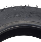 3.50-10 (100/90-10) Tubeless Scooter Tire with QD004 Tread, showcasing detailed street tread pattern and clear sidewall markings for enhanced visibility. Ideal for vintage and modern motor scooters.