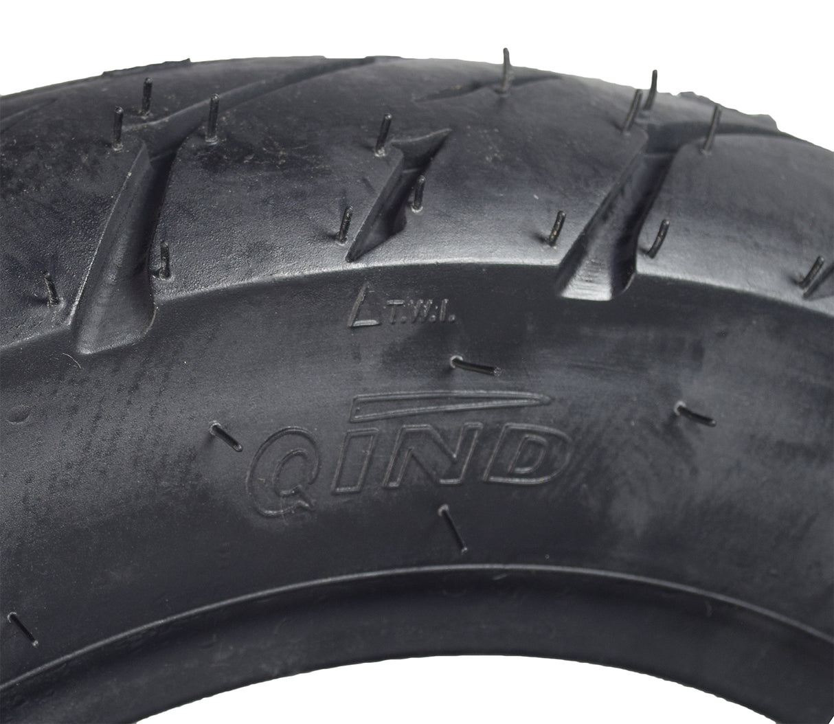 Close-up of a 3.50-10 (100/90-10) Tubeless Scooter Tire with QD004 Tread, showcasing its detailed synthetic rubber tread pattern designed for street use.