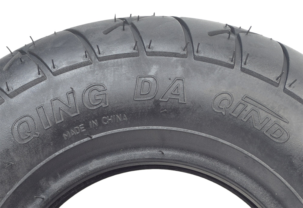 Close-up of the 4.10/3.50-6 (90/90-6) front tire with Q114 tread for the Minimoto Maxii and TrailMaster 163 Mini, showing detailed tread pattern and high-quality rubber construction.