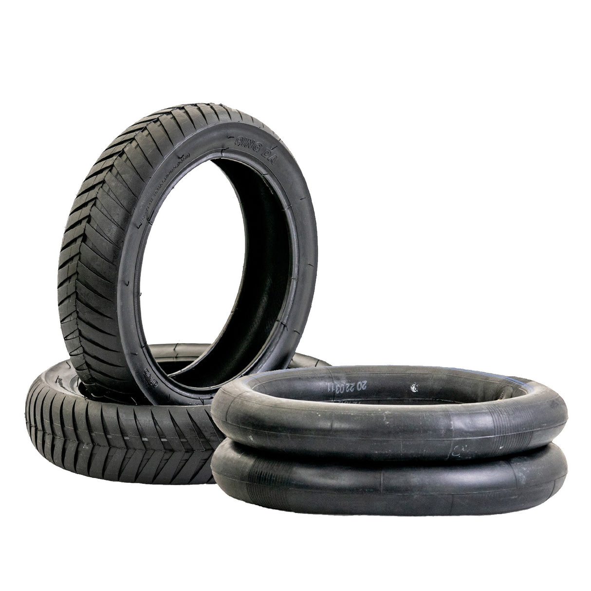 12-1/2x3.0 Tire with V-Groove Street Tread for Schwinn S500 Scooter, showcasing a stack of these tires with shallow grooves designed for enhanced grip on wet, hard-paved surfaces.