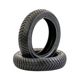 12-1/2x3.0 Tire with V-Groove Q212 Tread for Currie & Schwinn Scooters, featuring stacked black tires with classic Euro-scooter V-groove tread pattern for enhanced grip on paved surfaces.