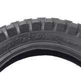 12-1/2x2.75 Dirt Bike Tire with KF824 Knobby Tread for Razor MX350 & MX400 Dirt Bikes, featuring a close-up view of its robust tread pattern and various markings.