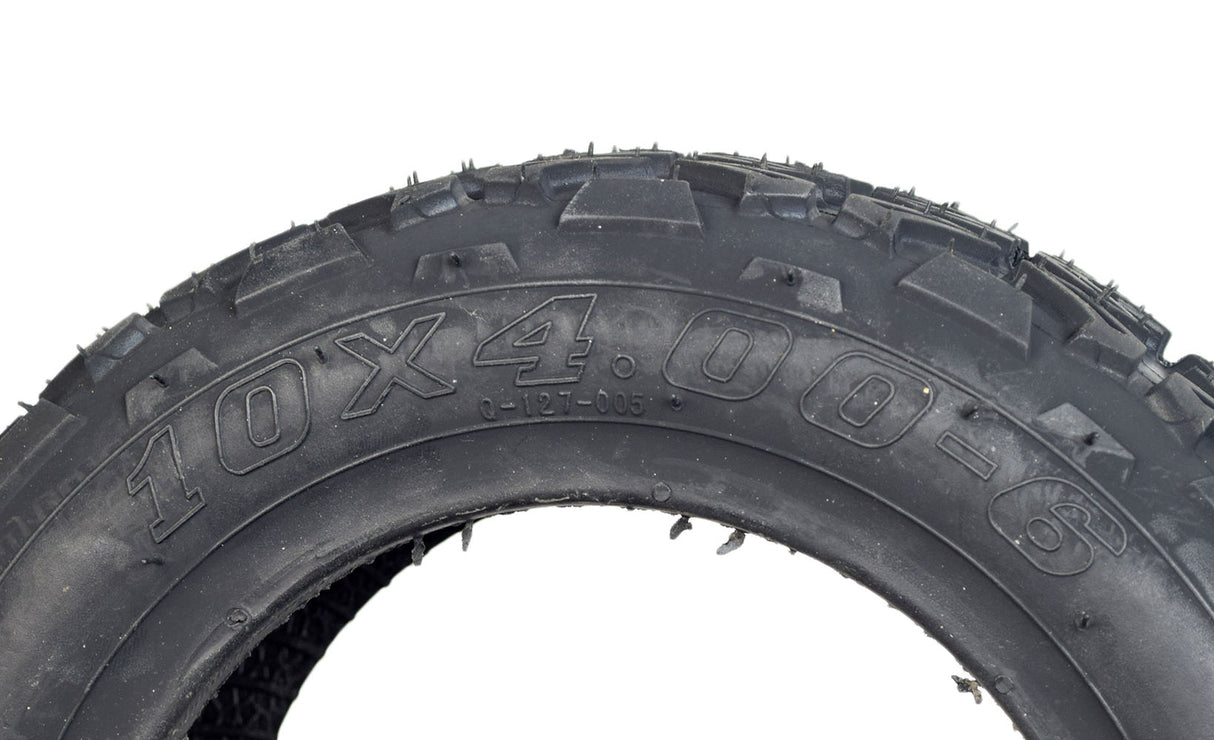 Close-up of a 10x4.00-6 Minimoto ATV Tire with Q127 Tread, showcasing its detailed tread pattern and robust construction, designed for optimal performance on Minimoto ATVs.