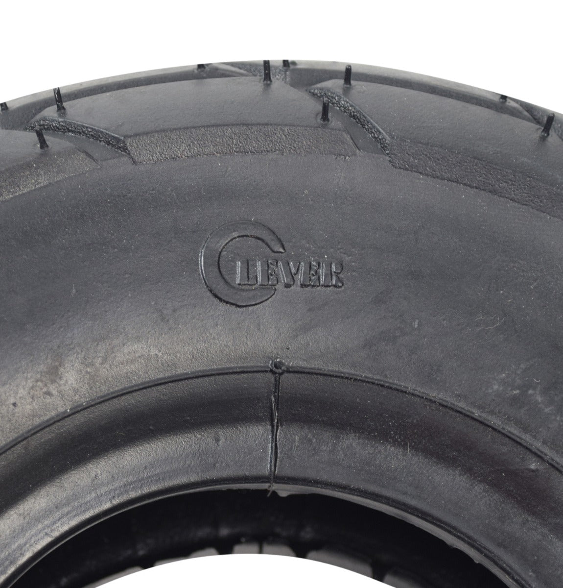 Close-up of a 10x3.50-4 (3.00-4) Minimoto Sport Racer Tire, showcasing its detailed rubber tread and sidewall markings.