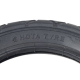 Close-up of the 12-1/2x2-1/4 (57-203/62-203) Scooter Tire with Q203 Tread, showcasing its detailed tread pattern and sidewall text.