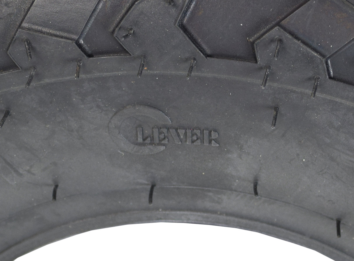 Close-up of a 145/70-6 tire with knobby tread for the Massimo MM-MB100 mini bike, highlighting its rugged tread pattern designed for off-road and on-road terrains.