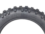 2.50-10 Trakmaster II Dirt Bike Tire with K760 Tread, featuring a knobby tread pattern, ideal for loose or rough surfaces. Close-up shows intricate tire details and text markings.