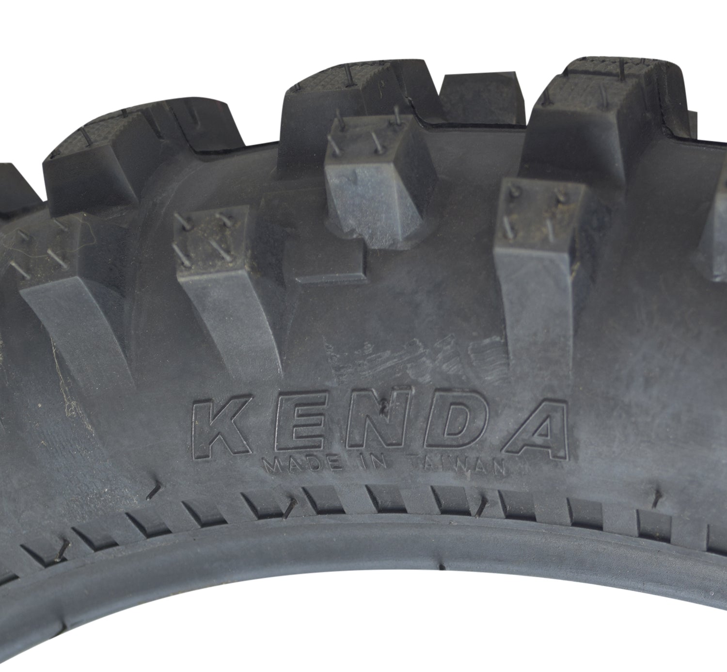 Close-up of the Kenda 90/100-16 Trakmaster II Dirt Bike Tire with K760 Tread, highlighting its aggressive tread pattern and durable sidewall construction.