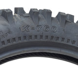 Close-up of a Kenda 90/100-16 Trakmaster II Dirt Bike Tire with K760 Tread, highlighting its deep, aggressive tread pattern and robust sidewall construction for enhanced cornering performance.