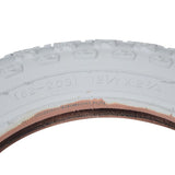 12-1/2x2-1/4 MX3 White BMX-Style Tire with brown band, featuring a close-up of its white K50 knobby tread, ideal for kids' bikes or small recreational electric scooters.