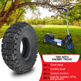 10x3 (3.00-4, 260x85) Knobby Tire for Avigo Extreme Dirt Rider SC 3500 & Surge 36 Volt Off-road Electric Scooters, shown next to a scooter in a park.