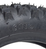 Close-up of a 2.50-10 rear tire for Razor MX500 and MX650 dirt bikes, featuring a knobby tread pattern designed for enhanced traction.