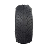 110/50-6.5 Tire for Mini Bikes featuring shallow grooved tread and spikes, designed for excellent traction on various mini pocket bikes.