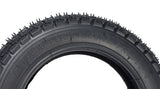 Close-up of the 10x2 (54-152) Dirt Bike & Scooter Tire with KF709 Tread, highlighting its mildly aggressive pattern designed for optimal control and performance on dirt tracks.