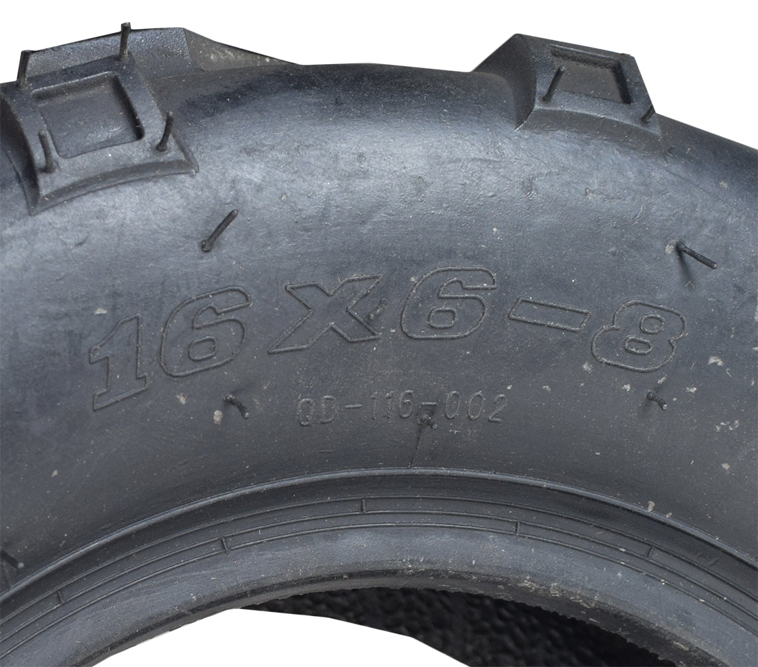 Close-up of the 16x6-8 Rear Tire for the Coleman KT196 Go-Kart, showcasing its bold V-tread design for superior traction on loose surfaces like mud, sand, and gravel.