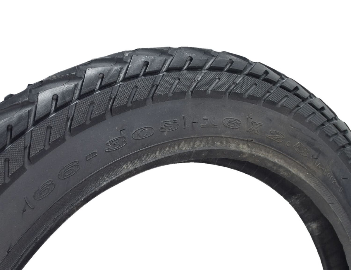 Close-up of a 16x2.50 (64-305) tire for X-Treme Electric Scooters & Bikes, showcasing its all-season tread pattern and directional arrows on the sidewall for proper mounting direction.