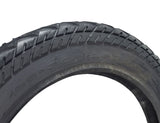 Close-up of a 16x2.50 (64-305) Tire with HJ308 Tread for Scooters & Jogging Strollers, highlighting the directional tread pattern and sidewall arrows indicating rotation direction.