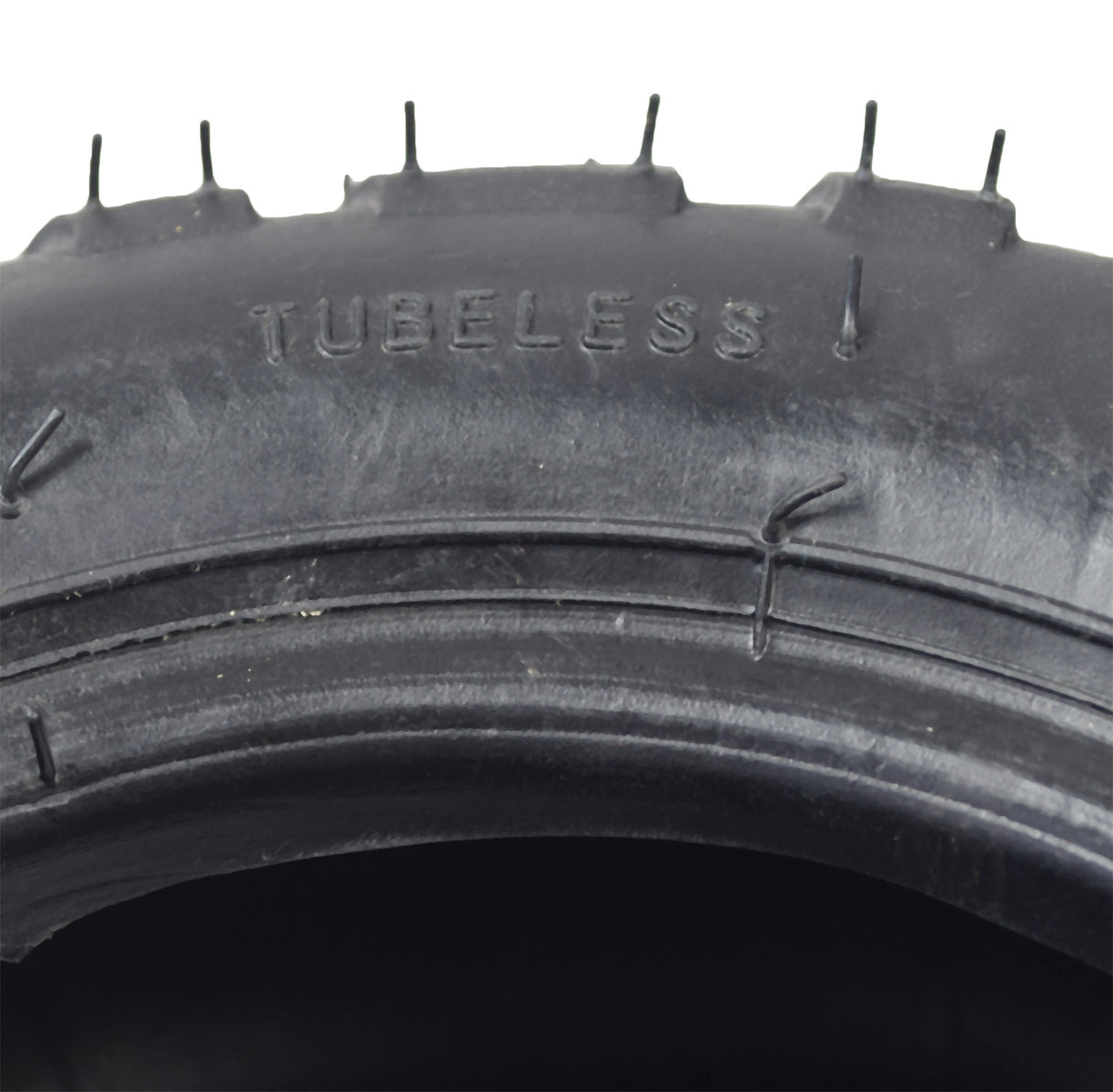 9x3.50-5 Off-Road Electric Skateboard Tire with Q138 Tread featuring prominent spikes, shown in a close-up image highlighting the rugged design and durable construction ideal for off-road use.