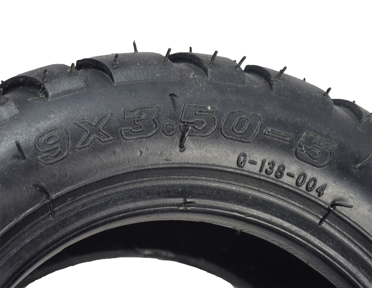 Close-up of a 9x3.50-5 Off-Road Electric Skateboard Tire with Q138 Tread, showcasing detailed tread patterns and tire inscriptions. Suitable for electric skateboards, small go-karts, and utility carts.