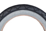 Close-up of a 12-1/2x2-1/4 Gray Wall Scooter Tire with black rim, featuring detailed tread pattern.