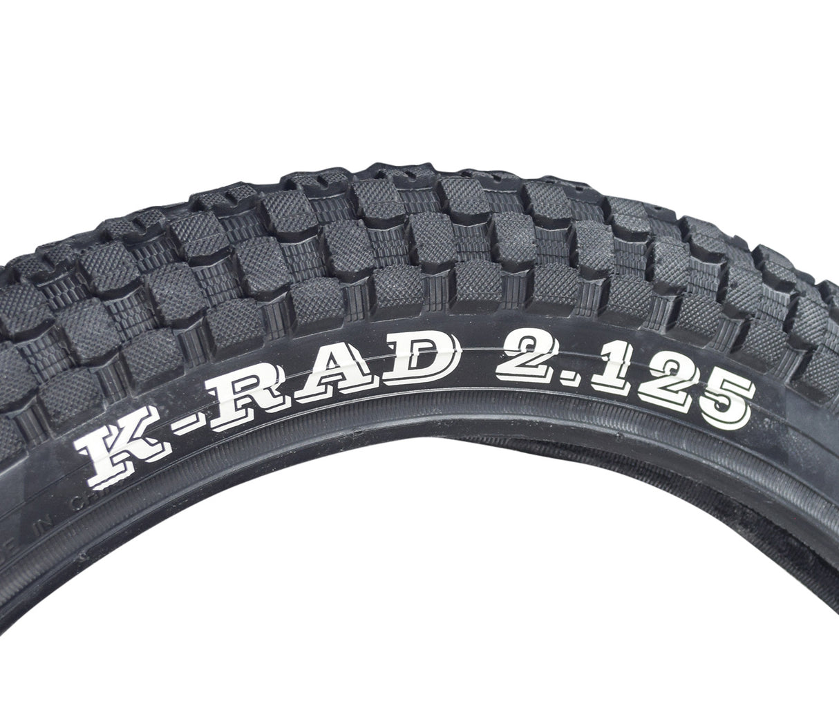 16x2.125 Bicycle Tire with K905 K-Rad Tread, close-up showing detailed tread pattern and white branding text on the black rubber surface.