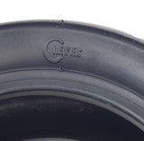 Close-up of a 110/50-6.5 tire for the Motovox MBxXSe Micro-Mini Bike, highlighting the shallow grooved tread pattern designed for excellent traction without damaging the lawn.