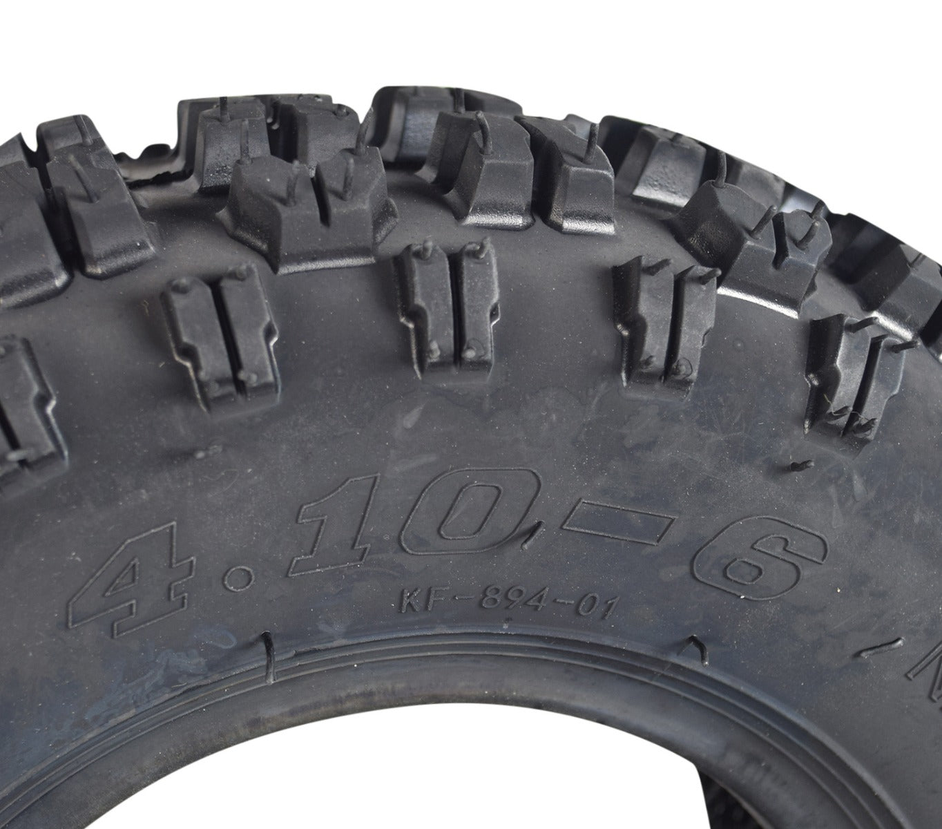 Close-up of the 4.10-6 ATV & Mini Bike Tire, showcasing its aggressive tread pattern designed for superior grip on loose surfaces, ideal for front rims of recreational offroad models.