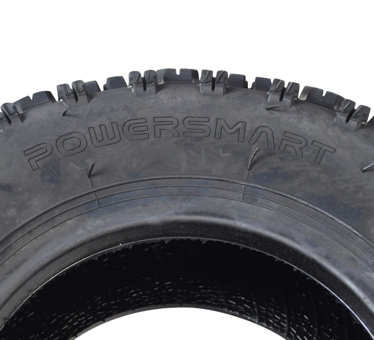 Close-up of a 4.10-6 ATV & Mini Bike Tire showcasing its aggressive tread pattern for superior grip on loose surfaces, ideal for small recreational offroad models.