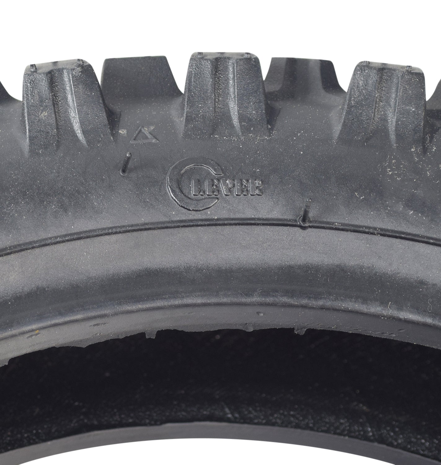 Close-up of a 2.50-10 Dirt Bike Tire for Baja, Honda, & Motovox Dirt Bikes, showcasing the directional knobby tread pattern ideal for 49cc, 50cc, and 70cc mini dirt bikes.